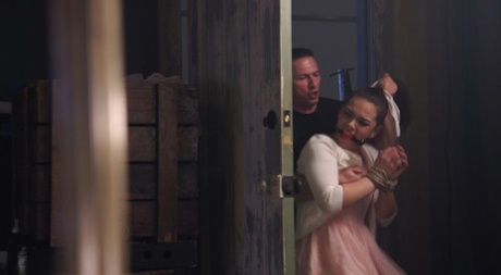 Two girls are fitted with ball gags while being held as sex slaves 64312387