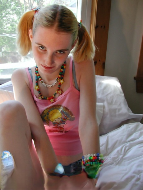 Young looking raver girl Cricket wears bangles while getting naked on her bed 57346967