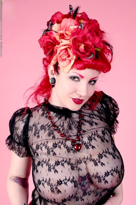 Redhead model Xanthia Doll poses non nude in see thru blouse and latex skirt 26783661