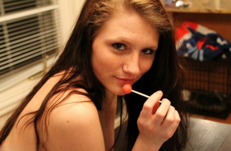 Barely legal girl Freckles 18 adorns her naked body with candy 19243085