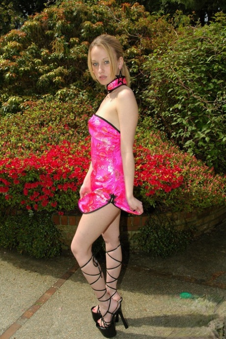 Young amateur Lucky partially removes a pretty dress near blooming bushes 20267143
