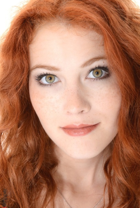 Natural redhead Heidi Romanova slips off animal print dress for nude posing 18072173