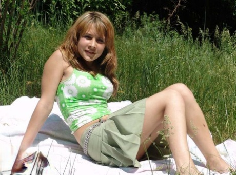 Sweet young teen Liza revealing her firm perky boobs on a blanket in the grass 14623176