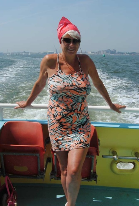 Busty hot mature Dimonty shows off her great legs & big tits in public 90277526