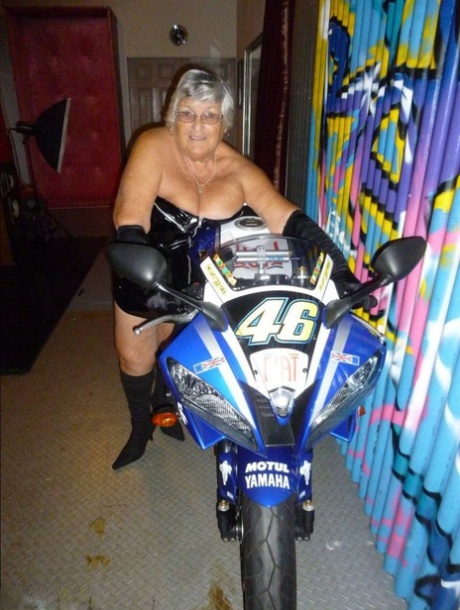 Old fatty Grandma Libby strips to black boots on top of a motorcycle 39454315