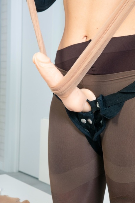 Hot blonde Enjoy covers herself in pantyhose while wearing a strapon cock 28298333