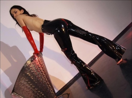 Slender solo girl poses in a variety of latex inspired outfits 47921915