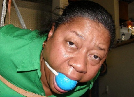 Overweight black woman is hogtied in a Santa hat while ball gagged 82676294