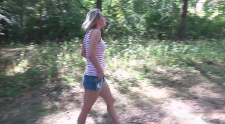 Blonde chick Bianca Ferrero takes a piss while out for a walk in the woods 82511245