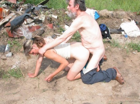 Horny mature lady seduces and fucks a homeless man amid his trash heap 51185790