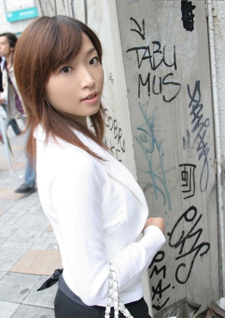 Young Japanese girl Koto sits on a toilet seat after undressing 81614324
