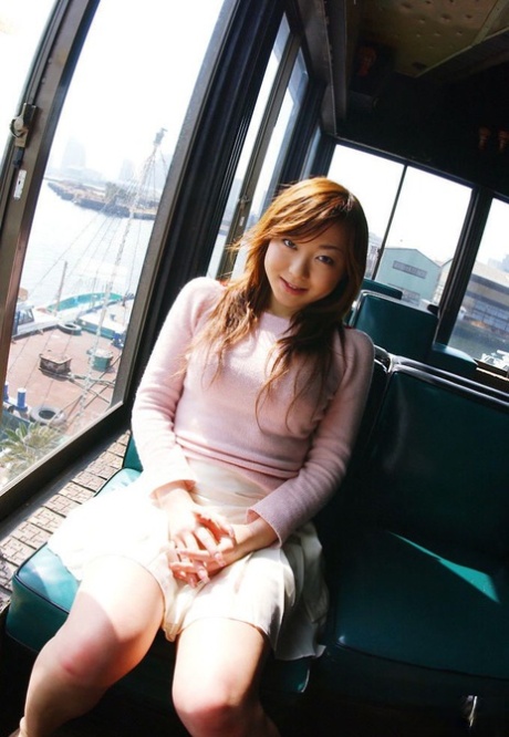 Cute redheaded Japanese girl Yumi gets mostly naked during solo action 78671770