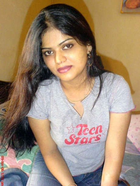 Petite Indian girl uncups big naturals after removing blue jeans 13813385