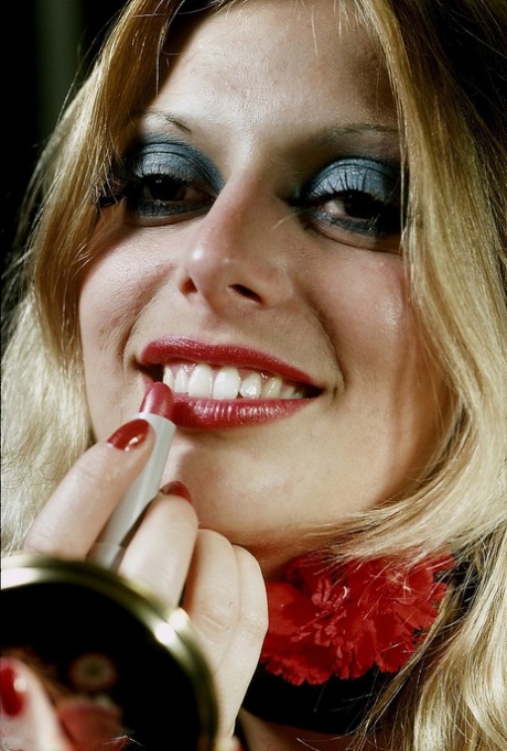 70s chick fixes her red lips in a mirror before smoking and masturbating 90890342