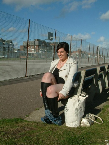 Brunette fatty exposes herself on a public bench before masturbating 21928026