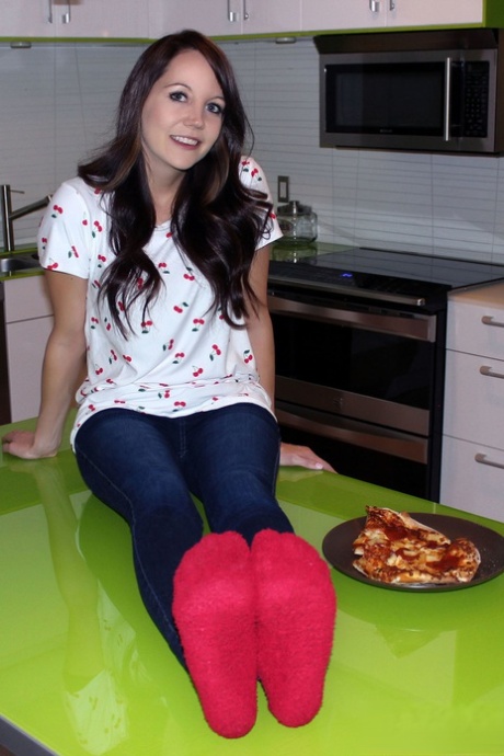 Young brunette Andi Land strips down to her socks while eating homemade pizza 96279904