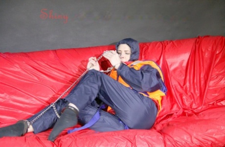 Caucasian chick is left gagged and restrained with chain in nylon rainwear 24309940