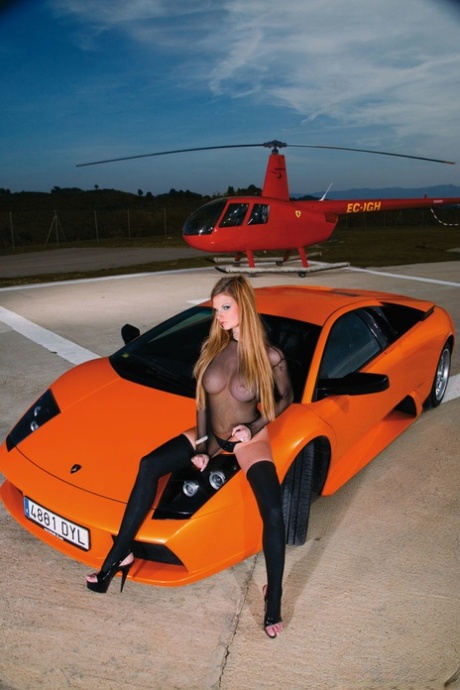 Redhead pornstar in black stockings gets banged on the hood of sports car 48860416