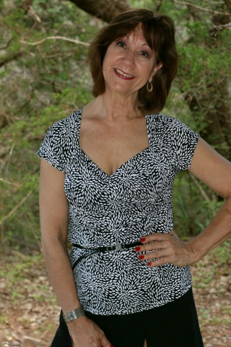 30 plus female Lynn flashes her tits and twat in the woods behind a patio 36266231