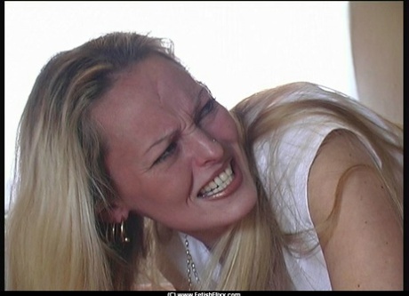 Three Caucasian girls have their bare asses caned by a man in a bedroom 21000153