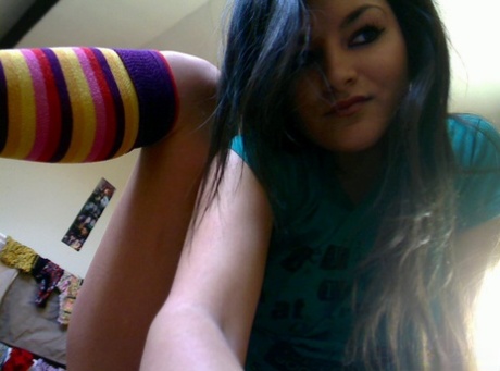 Cute brunette Gina teases in her bedroom while wearing striped socks 30346136