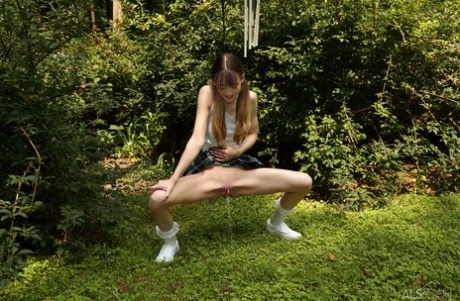 Skinny teen Michelle Anthony pees in the backyard before vaginal insertions 35138105