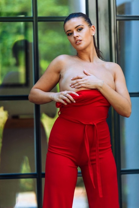 British beauty Brook Wright releases her big tits from a red pantsuit 72031746