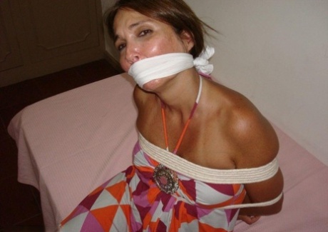 Two girls struggle against rope restraints while gagged at the same time 80169924
