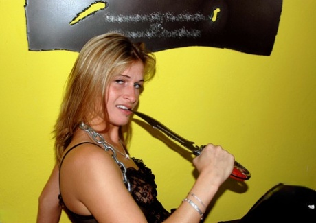 Solo girl wields a knife and a gun while in lingerie and thigh-high boots 92545484