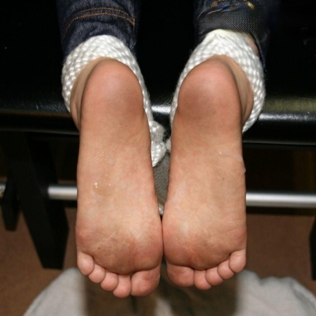 Caucasian woman displays the bottoms of her filthy feet 32358004