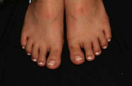 Caucasian female displays her pretty feet after receiving a pedicure 66565280