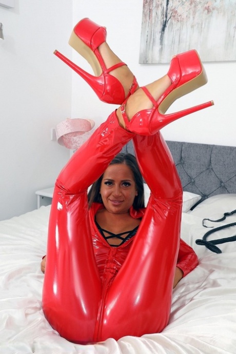 British MILF Lara Lee unzips from a red latex catsuit in matching heels 37480917