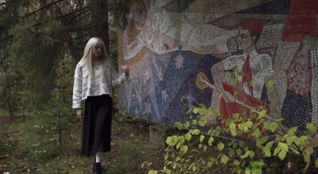 Nice blonde girl Eva Barbie takes a piss against an outdoor art installation 66813360