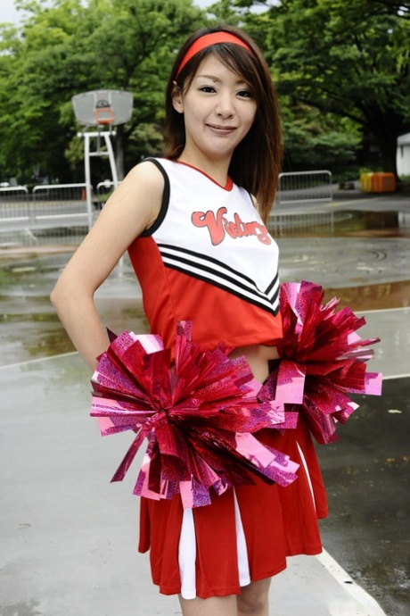 Japanese cheerleader Tomomi Matsuda gives a demonstration at a playground 99561144