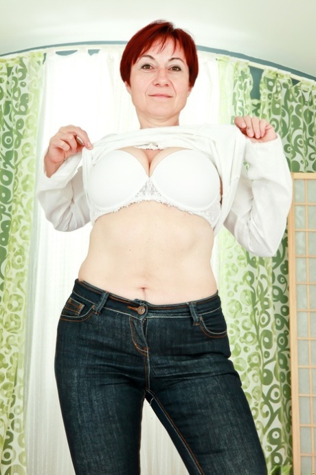 Older redhead Eva G shows her big naturals before sporting a creampie pussy 76419613