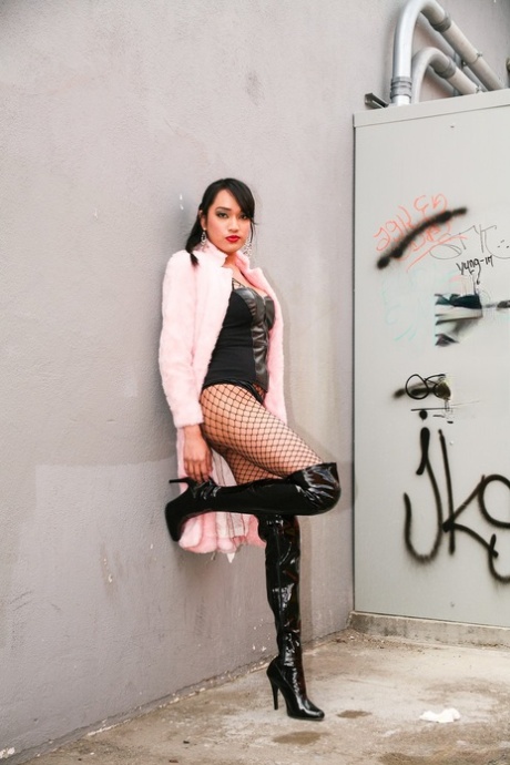 Asian beauty Jessica Fox models leather lingerie in fishnets and OTK boots 83665564