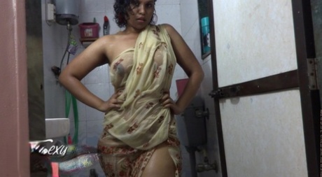 Plump Indian solo model Lily Singh lets her tits loose from her clothing 42948282