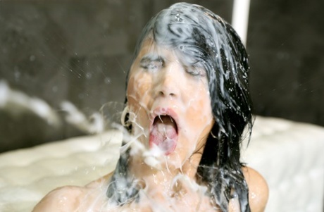 Dark haired girl gets plastered in sperm after discovering a gloryhole 97408107