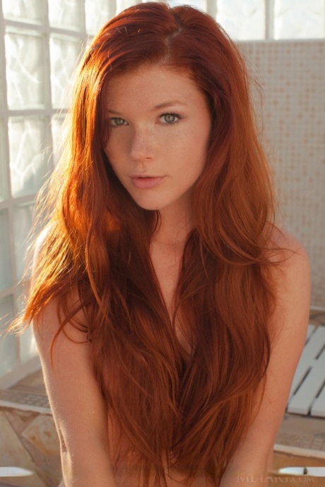 Redhead babe Mia Sollis revealing small teen tits and tight ass outdoors 28086189