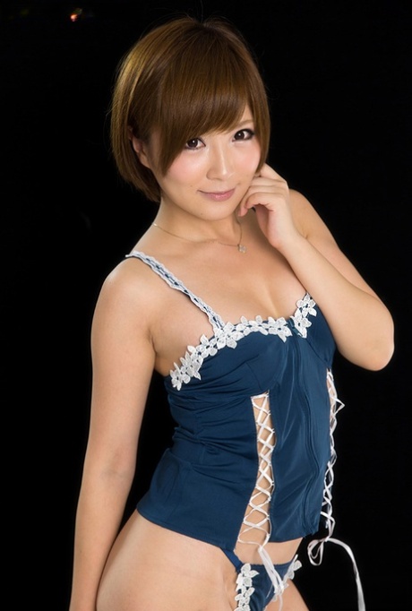 Adorable Japanese girl bares her nice tits and eagerly licks hard cock head 10486612