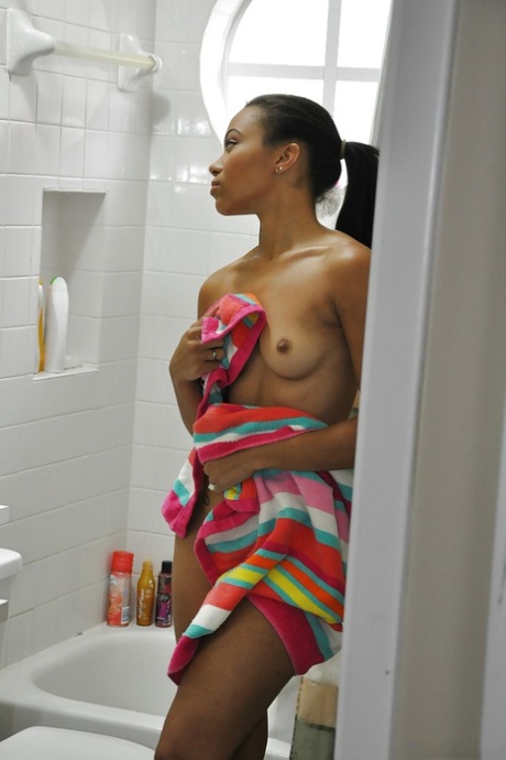 Ebony Adrian Maya undressing and taking shower in voyeur scene 81502555