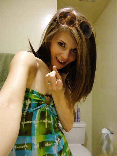 Babe in glasses and green dress Sensi Pearl never hides her shaved pussy 25679173