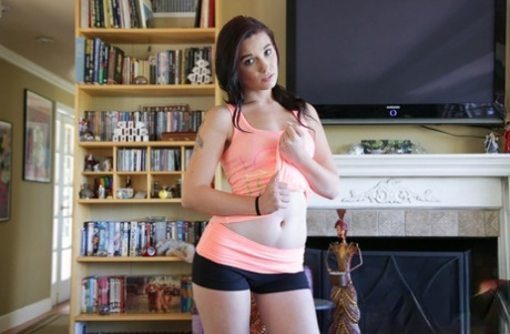 Amateur solo girl Riley Momsen sliding spandex shorts and undies over nice ass 79325076