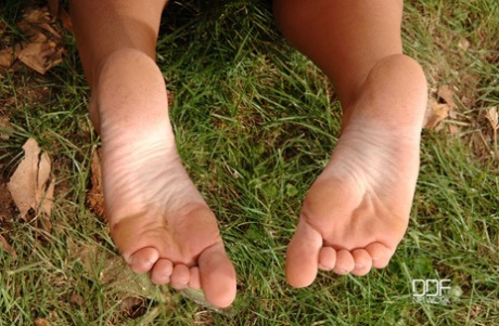 Lesbians Zuzana Z & Zoe L Fox play foot games out in the woods 14091743