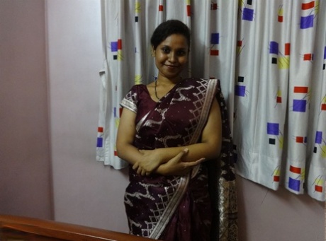Clothed Indian woman strips to her black bra and underskirt 46627943