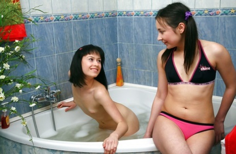 Teens Olga M & Veronique E teasing their shaved pussies in the shower 93098962
