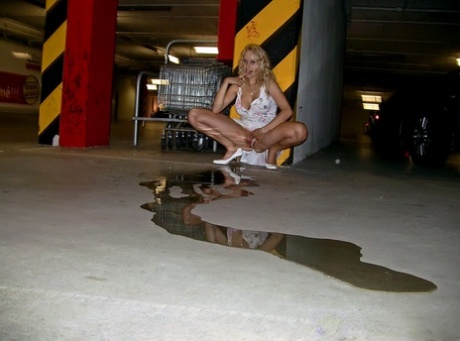 Lustful blonde pornstar doing upskirt and pissing in public place 97499383